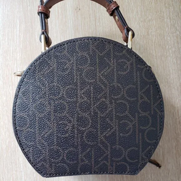 Calvin Klein Dark Brown Monogram Round Crossbody with Tan Handle - Picture 3 of 9